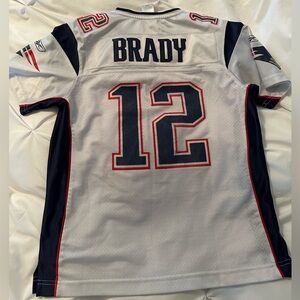 Tom Brady Jersey women’s medium. Please note the numbers are faded.